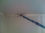 Drywall Corner Roller smoothing mud from tape