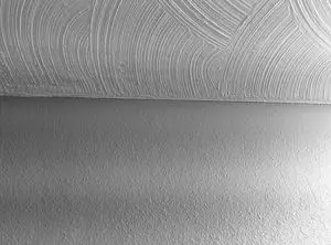 Photo of swirl drywall texture on the ceiling and knockdown texture on the wall