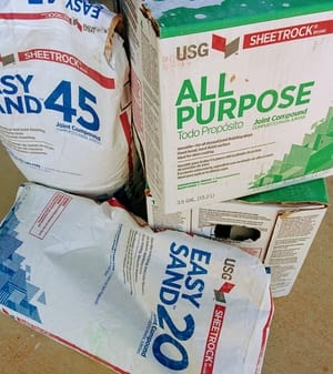 Photo of boxes of all purpose joint compound and 2 bags of hot mud
