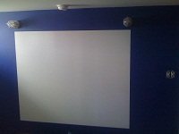 Picture of erasable whiteboard painted on dark blue bedroom wall