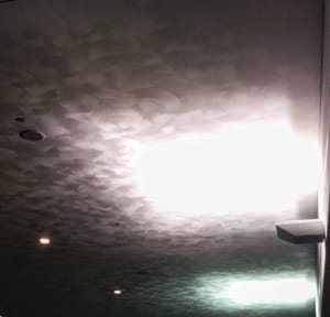 Photo of a random swirl drywall texture on a high ceiling